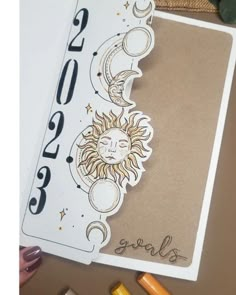 the sun and moon are on top of each other, with numbers written below them