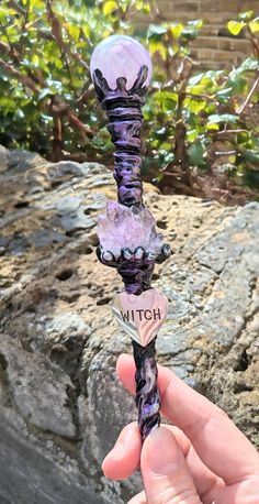 Gorgeous Handmade Wand & Stand ✨ Wand: 35cm approx, high quality aura amethyst sphere, amethyst cluster, metal Witch charm, rough clear quartz point end. The core of the wand is wood, then handcrafted with mouldable adhesive and painted with acrylics. Holder: 10cm approx, amethyst cluster, handcrafted with mouldable adhesive and painted with acrylics. Made with energy and intention! *HANDMADE TO ORDER, SMALL DIFFERENCES TO BE EXPECTED* *NOT A TOY, NOT SUITABLE FOR SMALL CHILDREN* *INSTRUCTIONS A Handmade Mystical Purple Crystals, Clay Crystal Holder, Amethyst Core, Witch Wands, Magic Objects, Wand Stand, Wand Holder, Aura Amethyst, Wand Crystal