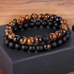 Tiger Eye With Black Onyx Beads Casual Brown Beaded Bracelets, Casual Black Beaded Bracelets With Round Beads, Casual Brown Round Beads Bracelets, Casual Brown Bracelets With Black Beads, Casual Brown Bracelet With Black Beads, Casual Black Beaded Bracelets With 8mm Beads, Elegant Brown Beaded Bracelets With Black Beads, Adjustable Brown Beaded Bracelets With Black Beads, Distance Bracelet