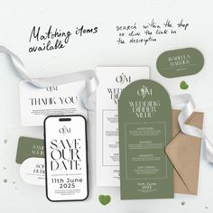 wedding stationery and save the date cards are laid out on top of each other