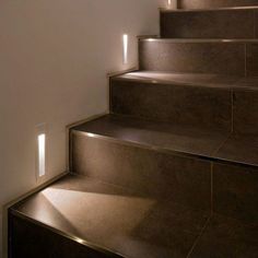 a set of stairs with light shining on them