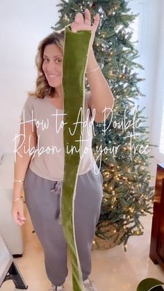 a woman standing in front of a christmas tree with the words how to add pole ribbon into your tree