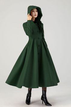 This dark green long wool coat, crafted to the highest standards of quality and design.  This exquisite a line swing wool coat is tailored to perfection, ensuring a snug yet elegant fit that exudes sophistication and style. DETAIL * 50% wool, 50% fiber,nylon, etc. * Fully satiny lining, more nice to the touch body * Two side seam pockets * Front buttons closure * Long wool coat * A line coat, Swing coat * Fit and flare coat * Formal coat * For autumn and winter * Dry clean only * Lean More about the items From the FAQs on the page bottom More color: https://www.etsy.com/listing/1591875219 MODEL SIZE Bust 85 cm(33.4") Waist 67 cm(26.7") Height 168cm (5' 6") She wears size XS Choose CUSTOM Order if you * Need a better fit * Can't find your size in our size Chart * Change the Style * Chang th Winter Long Sleeve Solid Color Wool Coat, Solid A-line Outerwear For Fall, Fitted Green Wool Coat For Winter, Green Fitted Wool Coat For Winter, Green Wool Coat For Winter, Green Single-breasted Wool Coat For Winter, Hooded Wool Coat With Buttons For Fall, A Line Coat, Elf Costumes