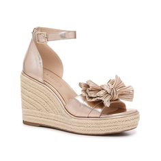 Kelly & Katie-Ibrina Wedge Sandal Look sophisticated and sweet in the Ibrina wedge sandals from Kelly & Katie. This pair features an eye-catching metallic hue, a girly bow detail, and a classic espadrille heel. Metallic High Heel Sandals For Summer, Metallic Sandals For Summer Beach, Metallic Sandals For Beach In Summer, Chic Metallic Sandals For Spring, Summer Metallic Platform Heels, Metallic Wedge Heel Sandals For Summer, Chic Metallic Sandals For Summer, Metallic Round Toe Sandals For Spring, Spring Metallic Round Toe Sandals