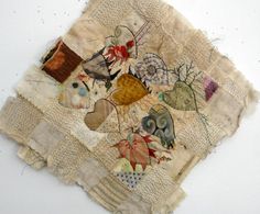 an old piece of cloth with various pictures on it