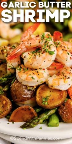 garlic butter shrimp with potatoes and asparagus on a white plate text reads garlic butter shrimp