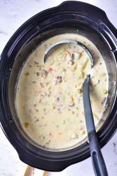 a pot filled with soup sitting on top of a table