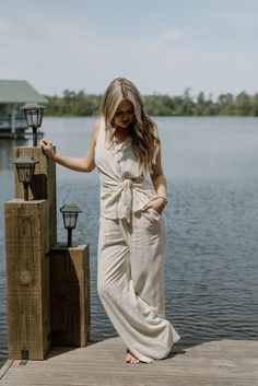 Experience effortless summer style with our Oatmeal Linen Sleeveless Button Up! Made from lightweight linen, this collarless top features a chic tie detail and button up design. Stay cool and stylish all season long.

runs true to size
model, Brooke is wearing a size small Sneaker Heels Wedges, Long Runs, Boutique Trends, Romper Dress, Dress Jewelry, New Tops, Stay Cool, Long Sweaters, Skirt Pants