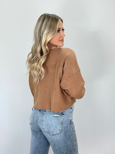 Elevate your winter wardrobe with our Brown Waffle Knit Shacket. The collared neckline and button closures exude sophistication, while the waffle knit provides a soft and stretchy feel for ultimate comfort. The relaxed, cropped fit with drop shoulders is perfect for lounging or running errands. Complete with pocket details, this shacket is a versatile and elegant piece for any casual occasion. Self 63% Cotton 34% Polyester 3% Spandex Contrast 100% Cotton Hand wash cold. Fall Cropped Sweater With Ribbed Neckline For Loungewear, Cropped Everyday Winter Tops, Ribbed Cropped Sweater For Fall Loungewear, Fall Waffle Knit Button-up Tops, Spring Waffle Knit Tops For Workwear, Relaxed Fit Waffle Knit Tops For Fall, Waffle Knit Fall Tops, Everyday Fall Waffle Knit Top, Fall Solid Color Waffle Knit Tops