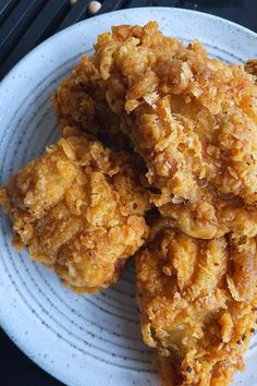 three fried food items on a white plate