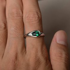 This is a gorgeous handmade creation. Its beauty is its simplicity & Elegance. The 5*7 mm oval shape faceted lab emerald is crafted in solid sterling silver and with rhodium plated. All item is sent in a beautiful gift box If you have any idea of design your ring,pls contact me directly. You can realize more lovely stuff clicking the link https://www.etsy.com/shop/knightjewelry?refshopsection_shophome_leftnav Please leave the correct address and you phone number for delivering successfully. Oval Faceted Birthstone Ring For Anniversary, Oval Faceted Crystal Promise Ring, Elegant Oval Faceted Emerald Ring, Oval Emerald Ring With Polished Finish, Teardrop Solitaire Emerald Ring Gift, Teardrop Emerald Solitaire Ring As A Gift, Teardrop Emerald Ring As Gift, Teardrop Emerald Ring For Gift, Oval Green Emerald Ring For Proposal