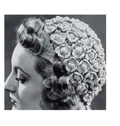 an old photo of a woman wearing a headpiece with flowers on it's side