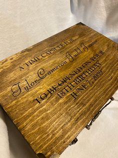 a wooden plaque that has writing on it