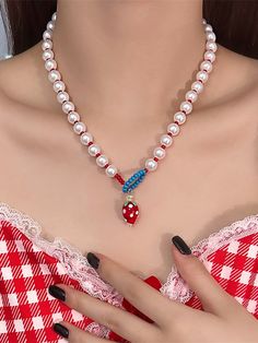 This charming necklace features an alternating pattern of large white beads and small red beads, creating a delightful visual contrast. The connection points are adorned with blue beads arranged in a sizable loop, allowing for easy adjustment of the necklace's length for added convenience. The necklace is further embellished with an adorable strawberry pendant, adding a touch of cuteness to the overall design.  Price includes one necklace only. Adjustable Red Pearl Necklace, Red Pearl Beaded Necklaces For Jewelry Making, Red Beaded Necklaces For Jewelry Making, Red Pearl Beaded Necklace With Round Beads, Steampunk Fashion Female, Rose Choker, Steampunk Fashion Male, Pink Puppy, Tie Necklace