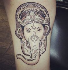 an elephant with a crown on its head is depicted in this tattoo design by person