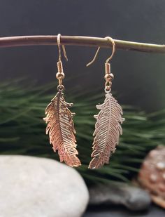 Gold Feather Earrings. Handmade using alloy metal filigree etched feather shaped pendants placed on stainless steel golden coloured hook back ear wire or round golden round lever back Earrings, please chose in options before checkout. The feather pendants are 3.5 cm in length and 1.5 cm in width.  These beautiful boho golden feather Earrings are a perfect gift for her, mum, daughter, girlfriend, wife and every day accessory. The feather pendants have a detailed design and wonderful spiritual ang Adjustable Gold Feather Earrings, Gold Feather Earrings As A Gift, Gold Feather Earrings For Gift, Dangle Feather Jewelry As A Gift, Feathered Dangle Jewelry As A Gift, Earrings With Price, Golden Feather, Gold Feather Earrings, Boho Feathers