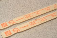 two wooden toothbrushes sitting on top of a counter