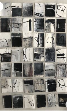 an abstract painting with black and white squares