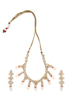 Royal Indian Kundan Necklace. This beautifully handcrafted necklace is set in silver and copper alloy and plated with 22k gold. Elegant and modern, this kundan and necklace will complete your lavish ensemble in grandeur. Necklace Size - 18 inches. Closure - Adjustable dori Earring Size: 4 cm DETAILS -100% top Quality -22K gold and silver Plated silver copper alloy. -Handcrafted in our all girls workshop in Paisley Pop Studio, Jammu and Kashmir STYLE TIP Best accessory for everything including In Designer Kundan Hand Set Necklaces, Hand Set Kundan Necklaces For Designer Wear, Temple Jewelry Necklace For Diwali Designer Wear, Diwali Temple Jewelry Necklace For Designer Wear, Diwali Temple Jewelry Designer Necklace, Traditional Gold Necklaces For Designer Wear, Designer Gold Jewelry Sets For Festivals, Gold Jewelry Sets For Designer Wear At Festivals, White Jewelry For Designer Festivals