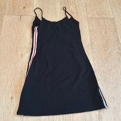 Black, Cotton Mini-Dress From Brandy Melville. Almost Never Used- Great Condition. Side Detailing. One Size Fits All. Black Stretch Cotton Mini Dress, Black Cotton Mini Dress, Black Cotton V-neck Mini Dress, Brandy Melville Amara Dress, Amara Dress, Brandy Melville Dress, Burgundy Shorts, Ditsy Floral Dress, Cotton Mini Dress