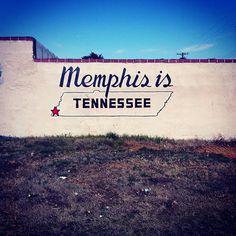 a sign on the side of a building that says, memphis is tennessee