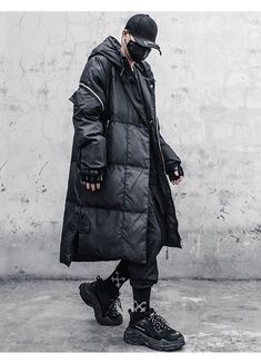 Conquer the cold with this long techwear jacket for urban ninjas. Introducing the ultimate winter coat for the urban ninja - the Techwear Parka. This futuristic jacket is designed to provide both style and function, making it the perfect addition to any wardrobe. Made from a waterproof and water-repellent outer fabric, this techwear coat is built to withstand all weather conditions, keeping you dry and comfortable no matter what Mother Nature throws your way. With a warm and comfortable lining i Techwear Winter Outerwear With Detachable Hood, Winter Techwear Outerwear With Detachable Hood, Winter Techwear Parka Windproof, Winter Techwear Windproof Parka, Cyberpunk Outerwear For Urban Winter Adventures, Winter Techwear Outerwear For Urban Adventures, Winter Techwear For Urban Adventures, Black Oversized Techwear Parka, Oversized Black Techwear Parka