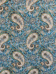 a blue and white paisley print fabric