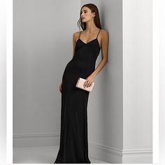 A Radiant Choice For Your Next Occasion, This Lauren Ralph Lauren Gown Unites A Glamorous Column Silhouette With A Contemporary Twisted Detail At The Back Waist And Chain-Trimmed Straps. The Smooth Hand Of Stretch Jersey Affords A Fluid Drape And Ease Of Movement. Imported Twisted Detail At The Center Back Waist Chain-Trimmed Spaghetti Straps Sleeveless Silhouette Column Silhouette Bust Darts Pull-On Styling Fully Lined V-Neck V-Back Elegant Floor-length Slip Dress For Formal Occasions, Elegant Floor-length Slip Dress For Formal Events, Classic Black Evening Dress, Sleek Maxi Dress With Spaghetti Straps For Formal Occasions, Classic Formal Dress With Spaghetti Straps, Sleek Spaghetti Strap Maxi Dress For Formal Occasions, Sleek Black Gown For Formal Occasions, Classic Evening Slip Dress With Spaghetti Straps, Elegant Evening Dress With Sweep Train And Spaghetti Straps