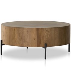 a round wooden table with metal legs