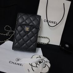 Exquisite Genuine Leather: The Chanel Crossbody Phone Bag is crafted from luxurious genuine leather, offering a refined texture and lasting durability. This high-quality material elevates the bags elegance while ensuring it withstands everyday use. Timeless Chanel Aesthetic: Embodying Chanel's classic design philosophy, this tote bag features the iconic quilting pattern and subtle yet distinctive logo. The timeless aesthetic makes it a versatile accessory, perfect for both casual and formal settings. Convenient Crossbody Design: Designed for practicality, the bag includes an adjustable crossbody strap, allowing for comfortable and hands-free wear. The versatile strap can be worn across the body or over the shoulder, adapting to your style needs. Compact Yet Functional: Despite its compact Chanel Plaid, Smartphone Pouch, Chanel Aesthetic, Classic Phones, Crossbody Phone Bag, Luxury Iphone Cases, Chanel Crossbody, Luxury Phone Case, Bag Elegant