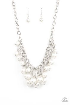 Oversized white pearls dance from the bottoms of shiny silver ovals that delicately cluster along a chunky silver chain, resulting in a luxurious fringe below the collar. Features an adjustable clasp closure.

Sold as one individual necklace. Includes one pair of matching earrings. Silver Pearl Necklace, White Pearl Necklace, Party Necklace, White Bracelets, Life Of The Party, Jewelry Images, Paparazzi Accessories, White Necklace, Rhinestone Bracelet