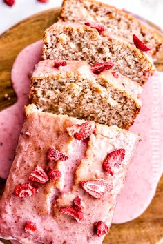 two slices of banana bread with raspberry toppings on a pink platter