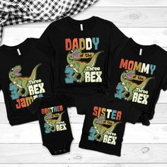 three baby onesuits with the words daddy, mommy and sister printed on them