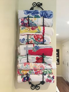 a stack of folded towels hanging on a wall