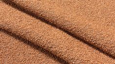 a close up view of a brown carpet