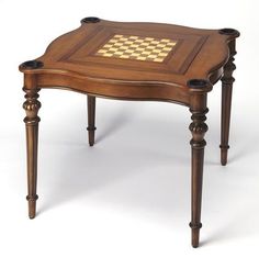 an old wooden table with chess board on it's top and two cups at the bottom