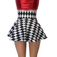 Our newest skirt style! We are in love with this lace-up, open-front mini skirt in black and white diamond harlequin print with metallic red ties on the corset waistband. The tie-up front offers an adjustable fit and the skirt is a single layer. Retro Mini Length Party Bottoms, Gothic Mini Length Skort For Party, Gothic Mini Skort For Party, Retro Mini Skirt For Parties, Retro Party Mini Skirt, Fitted Mini Length Bottoms For Costume Party, Fitted Mini Skirt For Cheerleading, Fitted Cheerleading Mini Skirt, White Fitted Gothic Bottoms