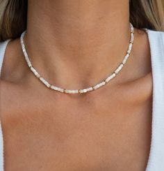 Description - Our Coral Reef Necklace is a combination of natural stone and glittering gold beads, evoking the magic of a sunlit coral reef. This dreamy necklace goes basically with everything, from a sophisticated business look to a summer dress with sandals. Premium Stainless Steel + 18k gold PVD coating Natural Mother of Pearl Stone Length ~ 15 in + 2in extender Width ~ 4mm Water-Resistant Hypoallergenic All orders come with free stickers!*gift ready* Summer Gold Pearl Necklace, Gold Necklaces With Round Beads For Vacation, Elegant Beaded Jewelry For Vacation, Summer Pearl Jewelry In Gold, Handmade Elegant Beaded Necklaces For Vacation, Gold Jewelry With Colorful Beads For Summer, Elegant Beaded Necklaces For Vacation, Elegant Handmade Beaded Necklaces For Vacation, Gold Pearl Jewelry For Summer