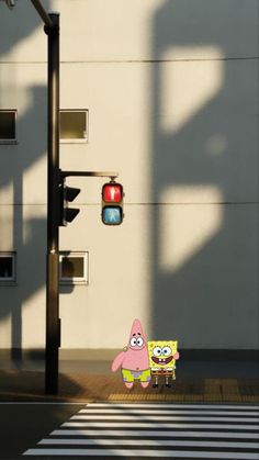 a cartoon character crossing the street in front of a traffic light