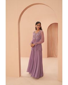 Lilac Breeze Sharara Set - Parul Gandhi Elevate your style with a beautiful peplum sharara set featuring delicate floral embroidery adorning the torso. This ensemble exudes sophistication, combining the trendy peplum silhouette with intricate floral details for a perfect balance of elegance and modern flair. Included in Purchase: Sharara Top, Pant & Dupatta Product Specification Color: Lavender Fabric: Georgette Neckline: Scoop Occasion: Bridal, Engagement, Formal Event Designer: Parul Gandhi Wo Elegant Floral Embroidered Sharara With Peplum, Elegant Sharara With Floral Embroidery And Peplum, Elegant Peplum Sharara With Floral Embroidery, Elegant Floral Embroidered Peplum Sharara, Purple Georgette Palazzo Set, Purple Palazzo Set With Floral Embroidery For Wedding, Purple Floral Embroidery Palazzo Set For Wedding, Wedding Purple Palazzo Set With Floral Embroidery, Purple Floor-length Chikankari Embroidered Sharara