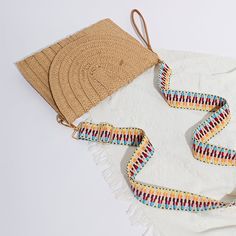 Embrace Boho Chic Style Elevate your summer wardrobe with the Women's Bohemian Straw Clutch Handbag, a perfect blend of style and functionality. This hand-woven rattan straw clutch is designed to bring out your inner bohemian spirit while keeping your essentials secure. Ideal for beach outings, casual gatherings, or even an evening stroll, this versatile purse will quickly become your go-to accessory for the season. Product Features Material: Made from high-quality straw for a natural and eco-friendly look. Design: Hand-woven with intricate detailing, giving each bag a unique, artisanal touch. Shape: Frame design that offers ample space without compromising style. Straps: Single, durable shoulder strap for comfortable carrying. Closure: Secure hasp closure to keep your belongings safe. Lin Casual Rectangular Clutch With Adjustable Strap, Spring Rectangular Clutch With Adjustable Strap, Rectangular Clutch With Adjustable Strap For Spring, Rectangular Spring Clutch With Adjustable Strap, Spring Woven Natural Fiber Shoulder Bag, Casual Beige Clutch For Summer, Beige Casual Summer Clutch, Summer Straw Bag Adjustable, Summer Clutch Bag With Braided Handles