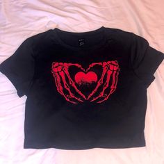 Black Cropped Tee, Red Skull Hands Holding A Heart. Super Cute, True To Size A Bit Stretchy. Size Medium. New Never Worn. Trendy Black T-shirt With Heart Print, Grunge Crew Neck Top With Heart Graphic, Black Trendy T-shirt With Heart Print, Grunge Short Sleeve Top With Heart Graphic, Casual Black T-shirt With Heart Shape, Black Heart-shaped Casual T-shirt, Casual Black Heart-shaped T-shirt, Black Casual Heart-shaped T-shirt, Casual Red Skull Print Tops