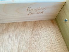 a wooden box with the word vaugh bassett engraved on it