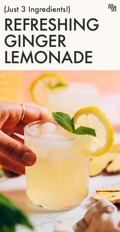 a hand holding a lemonade in front of a glass with the words just 3 ingredients refreshing ginger lemonade