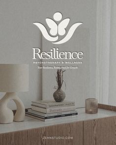 the logo for resilince is displayed on a shelf next to a lamp and books