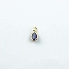 Material: 14k solid yellow gold (not gold plated or gold filled) Main Stone: Sapphire Main Stone Color: Blue Main Stone Shape: Oval Main Stone Creation: Natural Stone Size: 7x5 mm Carat Weight: 1.14 Carats Oval Birthstone Jewelry In Recycled Gold, Gold Teardrop Cabochon Jewelry, Minimalist 14k Gold Oval Cabochon Jewelry, Dainty 14k Gold Oval Cabochon Jewelry, Dainty Yellow Gold Oval Cabochon Jewelry, Minimalist Yellow Gold Cabochon Jewelry, Gold Pear-shaped Jewelry With Bezel Setting, Everyday 14k Gold Oval Cabochon Jewelry, Everyday 14k Gold Jewelry With Oval Cabochon