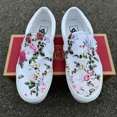 These luxurious and lush rose arrangements in vivid red, soft pink, and soothing white is perfect for any wedding! These custom slip on vans are classy enough for comfortable wedding shoes or a fancy brunch date! We source each pair of shoes BRAND NEW directly from Vans. The ink is permanent and will never come off. Made in the USA. This price includes everything: shoes and artwork. Bulk order discounts are available for your entire wedding party! Custom names, dates, or initials can also be added for an additional fee! Send us an email at info@blvdcustom.com to get started on your custom shoes for the big day! Red Wedding Shoes For Spring, White Wedding Sneakers For Summer, Spring White Slip-on Wedding Shoes, Custom Wedding Vans Brides, Custom White Wedding Vans, Embroidered Vans Wedding, Embroidered Vans Slip On, White Floral Embroidery Low-top Sneakers, Custom Slip On Vans