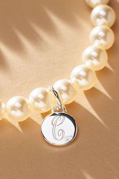 Elevate your special day with the exquisite Pearl Monogram Bracelet, a touch of personalization. Whether you opt for the initial of your cherished partner or choose to commemorate a beloved one, let this bracelet be a timeless symbol of connection and closeness. | Pearl Monogram Pearl Bracelet by Anthropologie in Alphabet, Women's, Gold/Plated Brass/Glass Anthropologie Bracelet, Pearl Bracelet Gold, Pearl Cuff Bracelet, Monogram Bracelet, Pearl Cuff, Timeless Symbol, Gold Bracelet Cuff, Silver Bangle Bracelets, Brass Glass