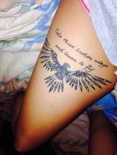 a woman with a tattoo on her leg that says, the time is now to fly