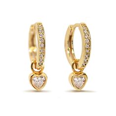 Tiny bezel set heart charm dangles from pavé huggie hoop earrings Total Height 0.7in(17mm) HOOP Inside Diameter 0.35in(9mm), Width 0.06in(1.5mm) HEART CHARM 5mm Click close mechanism #E445-G Charm Huggie Earrings For Anniversary, Huggie Charm Earrings For Anniversary, Huggie Earrings With Charms For Anniversary, Anniversary Huggie Hoop Earrings With Heart Charm, Valentine's Day Huggie Dangle Earrings With Heart Charm, Valentine's Day Heart Charm Dangle Huggie Earrings, Valentine's Day Dangle Huggie Earrings With Heart Charm, Dainty Heart Charm Huggie Earrings For Anniversary, Cubic Zirconia Heart Charm Dangle Earrings